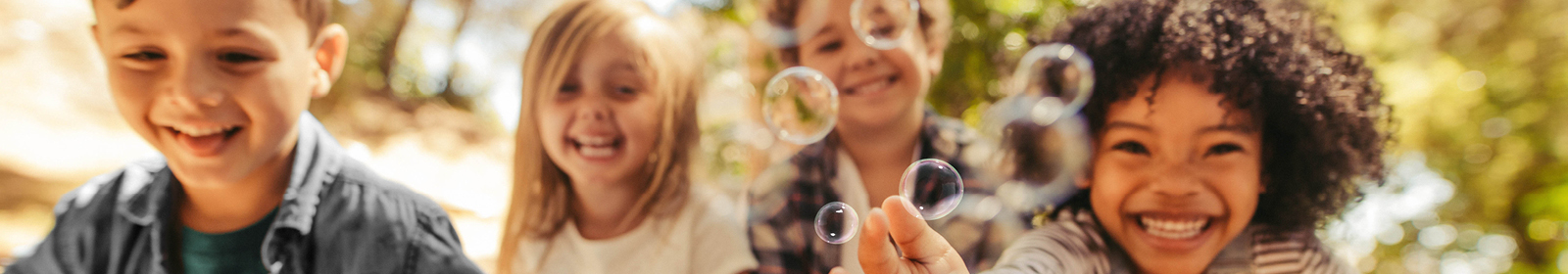 Children blowing bubbles. 